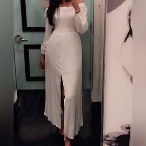 Women ivory long dress. Could be worn as off the shoulder. Also has a low slit.